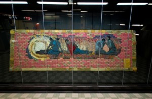 “Breaking Ground,” a commemorative quilt by Laurie Swim hanging at York Mills subway station.